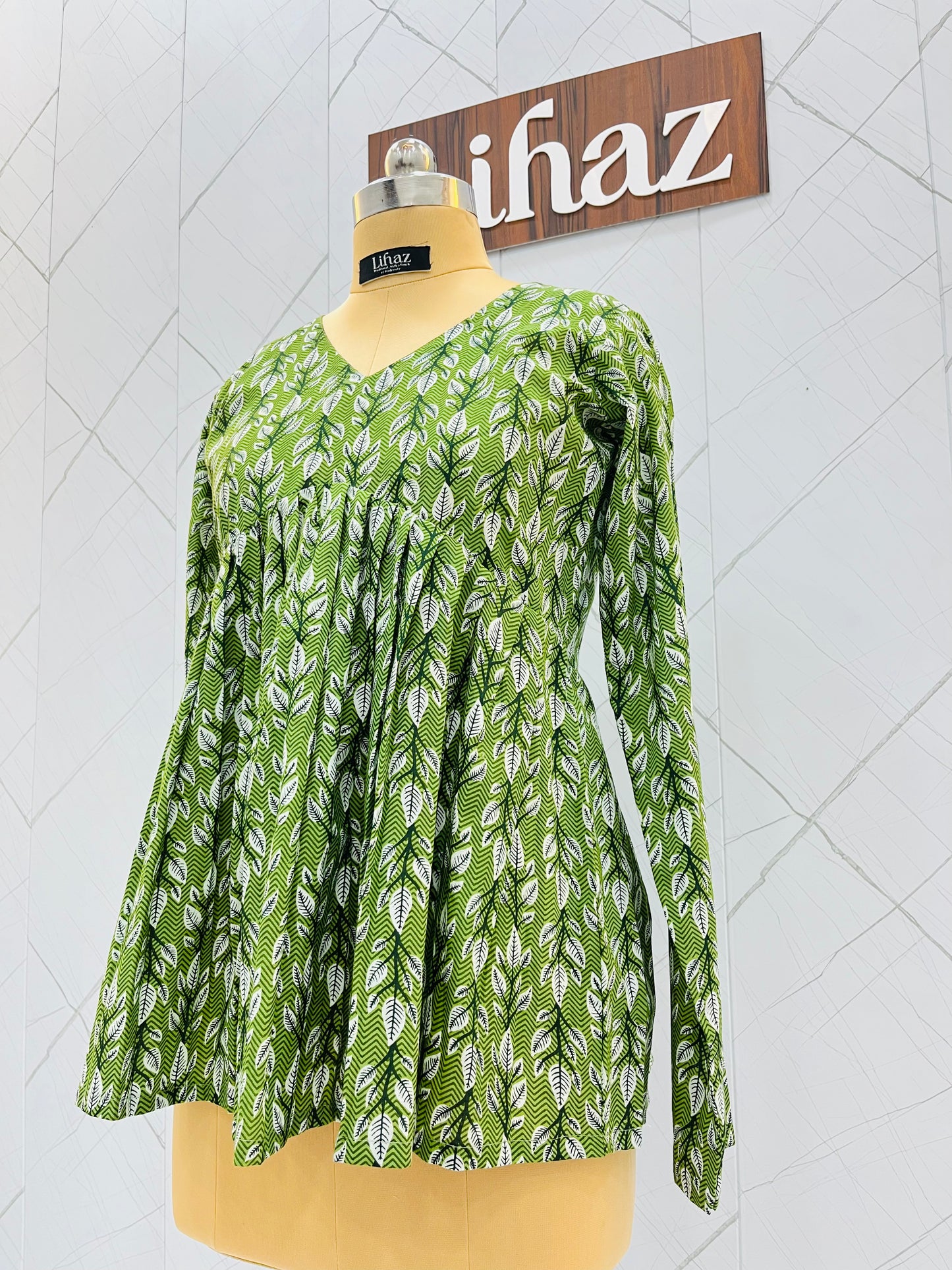 Green Peplum Top